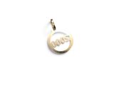 a close up of a gold pendant with the word love on it