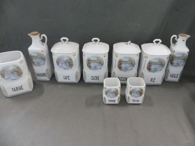 seven different types of ceramic containers and cups on the table