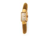 a close up of a gold wrist watch on a white background