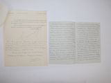 two pages of paper with writing on them sitting on a table