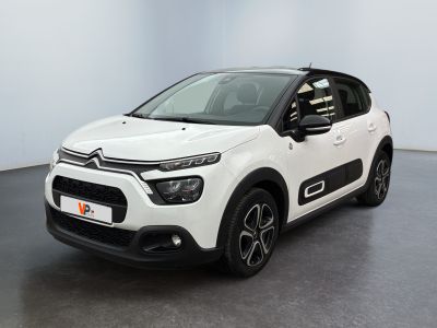 a white citrole is parked in a white room