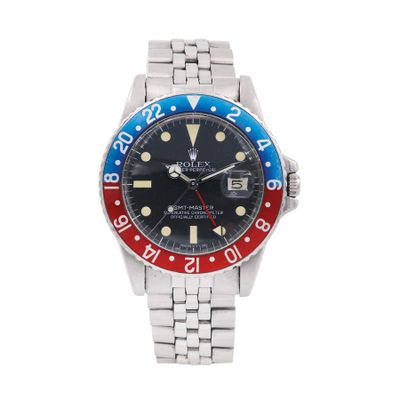 a close up of a wrist watch with a red and blue bezel