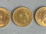 three gold sovereigns, one of which is a sovereign and one of which is a sovereign