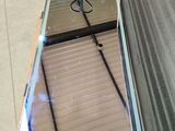 a metal box with a mirror on it sitting on the floor