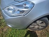 a close up of a car ' s headlight on the grass