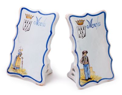 pair of blue and white salt and pepper shakers with a picture of a man and woman on them
