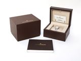 an image of a box with a watch inside of it on a white surface