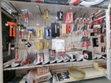 many different tools on the shelves in the store