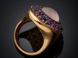 a close up of a gold ring with amethorate and amethorate