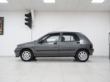 a picture of a small car parked in a showroom