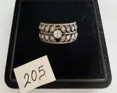 a ring that is sitting in a box with a price tag on it