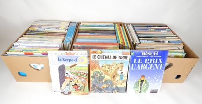 a box full of books sitting on a white surface