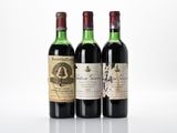 three bottles of wine sit side by side on a white surface
