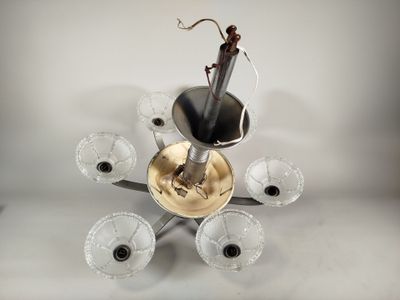a chandelier made of glass and a metal holder