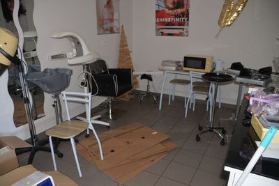 an image of a room with a lot of clutter on the floor