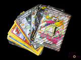 a lot of pokemon cards sitting on top of each other