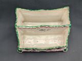 a close up of a white and green box on a table