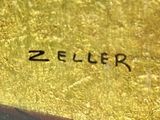 an image of a close up of a gold plate with a number on it