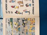 an old comic book opened to reveal a page of comics
