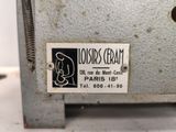 a label on the back of a machine that says lois cream