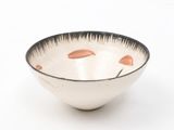 a white bowl with a black rim on a white surface