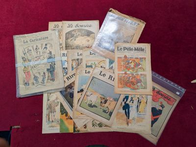 une pile de vieux journaux français par terre