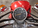 a close up of a motorcycle with a speedometer on it ' s handlebars