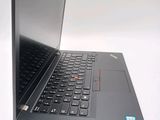 a close up of a laptop computer on a white surface