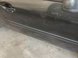 a car that has been dented and is parked in a garage