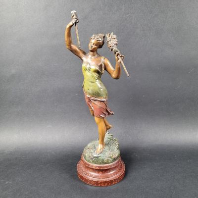an image of a statue of a woman holding a flower