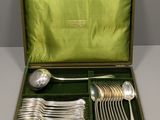 silver plated flatware in a case with green velvet lining