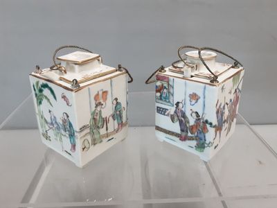two white boxes with pictures of people on them