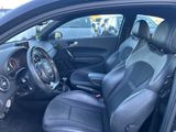 the interior of a car with black leather seats and a steering wheel