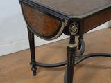 a small table with a drawer on top of it