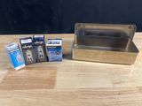 a small box of cigarettes sitting on a table next to a box of cigarettes