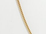 a close up of a gold necklace with a chain on a mannequin mannequin mannequin mannequin mannequin mannequin manne