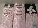 four men ' s pink and black striped shirts on display in a store