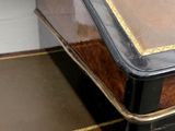 a wooden desk with a black top and a brown top