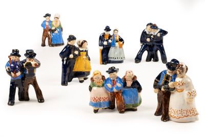 many figurines of people that are standing in a circle