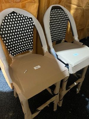 two chairs that are sitting next to each other