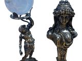 a statue of a woman holding a crystal ball and a statue of a woman holding a crystal ball