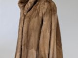 an image of a fur coat on a mannequin stand