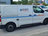 a white van that is parked in a parking lot