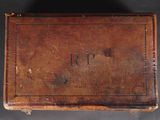 an old wooden box with the word r p engraved on it