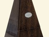an image of a wooden pyramid with a metal plaque on it
