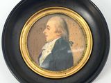 portrait d'un homme en manteau bleu, dans un cadre noir et doré