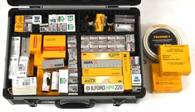 a briefcase with a lot of different items in it