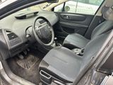 the interior of a car with the door open showing the dashboard