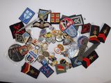 a lot of badges on a white surface