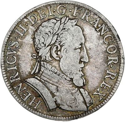 une pièce d'argent sur laquelle figure la tête d'un homme coiffée d'une couronne